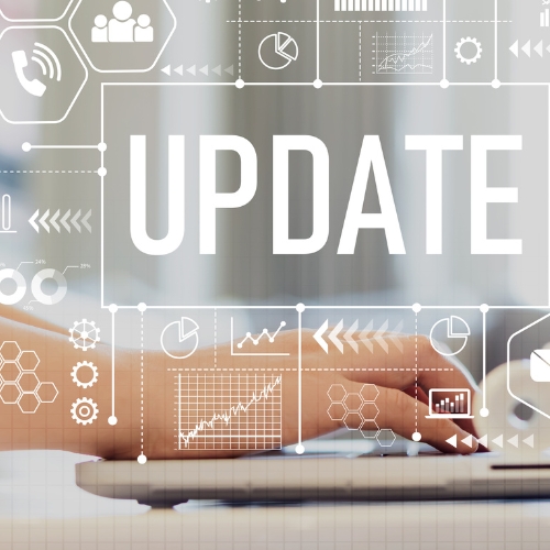  Person typing on a laptop computer with the words "Update"  in the background. 
