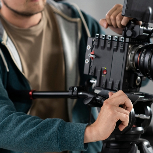 digital-creator-filming-with-professional-camera